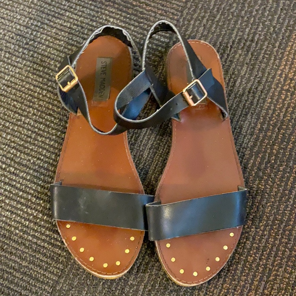 Black Steve Madden sandals with gold accents